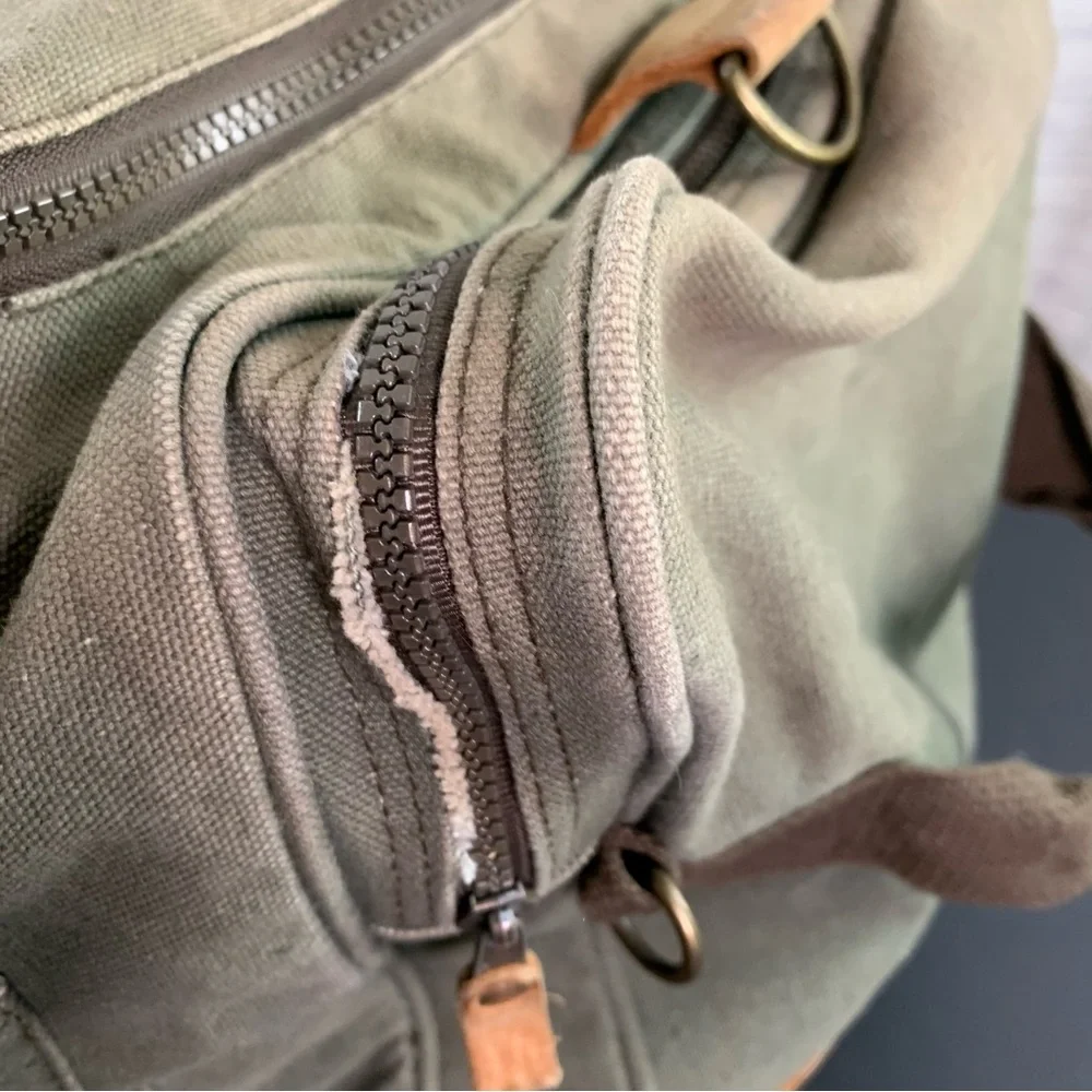 High Sierra Green canvas and Brown leather Duffel Bag.